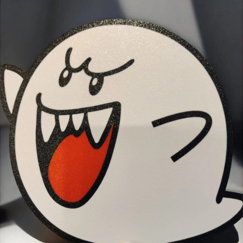 Coussin lumineux 3D blanc avec dessin de visage expressif, bordure noire scintillante, permet d'ajouter une touche d'originalité à la décoration intérieure.