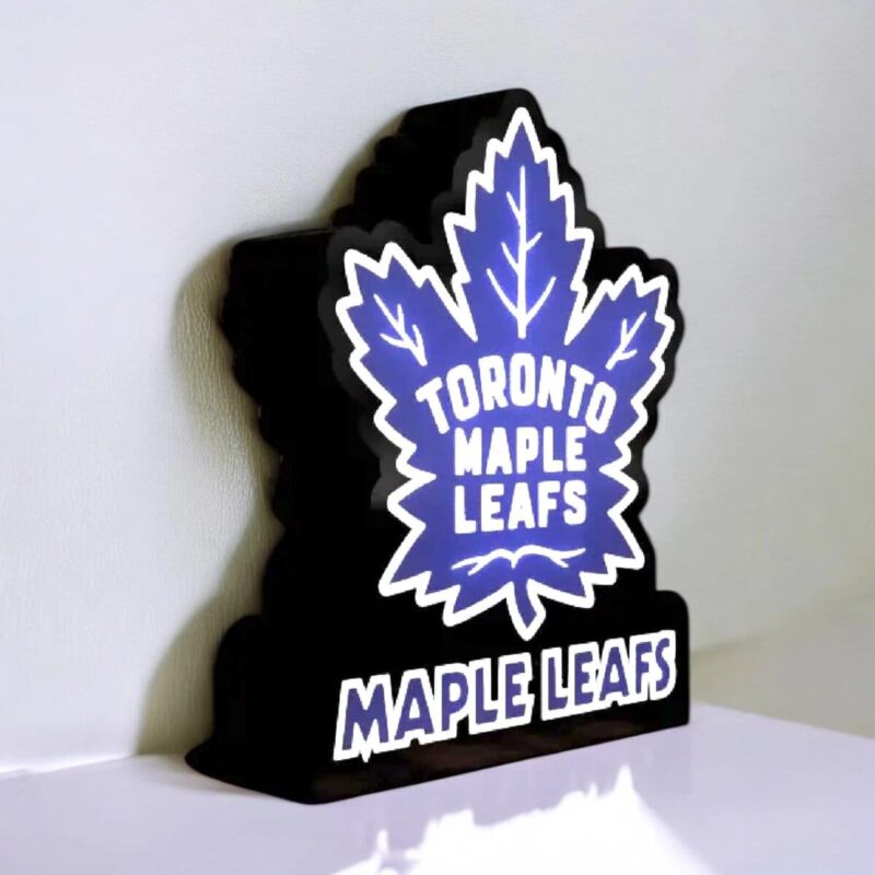 Lampe LED en forme de feuille d'érable avec inscription Toronto Maple Leafs, décoration lumineuse 3D, plateau en bois, éclairage coloré, idéale pour fans de hockey, décoration intérieure design, création artisanale unique.