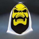 LED skull lamp 3D printed decor light for Halloween or gothic ambiance, illuminated with vibrant yellow and black colors, creating a striking and spooky effect.