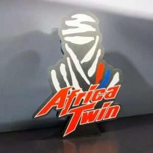 Sticker lumineux 3D "Africa Twin" avec logo coloré, designed pour ajouter une touche déco et lumineux à votre moto ou espace personnel, créée par Infinity 3D Print.