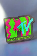 LED sign with MTV logo in vibrant colors, showcasing illuminated 3D printed art from Infinity 3D Print, perfect for music lovers and modern decor.