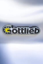 Logo personnalisé 3D lumineux avec texte "Gottlieb" et étoile jaillir en jaune, création LED 3D, conception unique, décor lumineux pour maison ou bureau, fabrication artisanale, design moderne et original.
