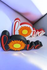Larmes LED en forme de mot "Love" avec motif de tournesol 3D, création lumineuse personnalisée en impression 3D, décoration intérieure, cadeau original, artisanat lumineux et design moderne.