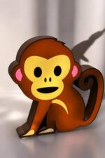 Lampe 3D design singe lumineux LED, décoration enfant, éclairage original et ludique, fabriquée avec impression 3D, couleur orange et jaune vibrant, idéal pour chambre d'enfant ou décoration d'ambiance.