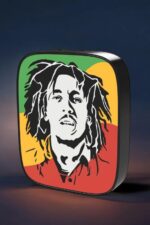 Luminaire LED 3D avec portrait de Bob Marley, design coloré et lumineux, crée une ambiance chaleureuse et artistique. Parfait pour décorer un espace avec style et originalité.