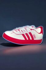 Lampe LED en forme de chaussure de sport rétro, création lumineuse 3D, illuminant avec design coloré blanc et rouge, idéale pour la décoration intérieure ou ambiance moderne, fabriquée par Infinity 3D Print.