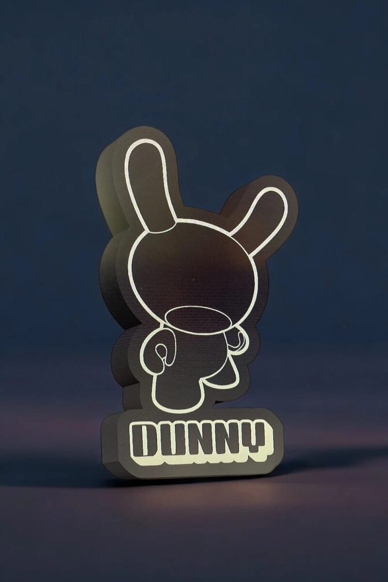 1745680254.jpeg Lampe LED 3D en forme de personnage cartoon avec écrit "Dunny", création lumineuse unique pour décoration intérieure.