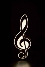 Lampe LED en forme de clé de sol musicale lumineuse, créative et décorative pour ambiance chaleureuse, idéale pour les amateurs de musique et la décoration d’intérieur.