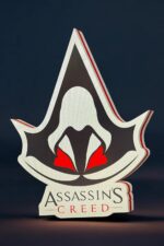 3. Logo Assassin's Creed en impression 3D avec design lumineux, parfait pour décorer une chambre ou un bureau avec une touche de gaming et d'élégance.
