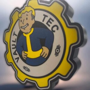 Logo de Vault Tec 3D imprimé en LED, création lumineuse inspirée de l'univers Fallout, mettant en avant un design détaillé et coloré pour une décoration originale et moderne.