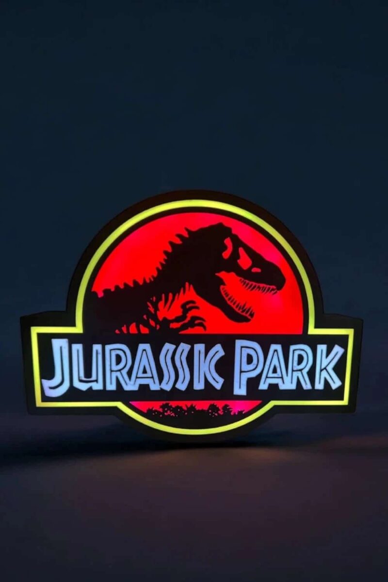 LED logo lumineux Jurassic Park, affiche rétroéclairée avec dinosaure T-Rex en silhouette rouge et noir, création lumineuse 3D pour décoration intérieure ou collection.