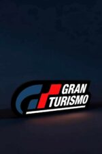 LED illuminated racing logo representing Grand Turismo, with bold red, white, and blue colors on a dark background.